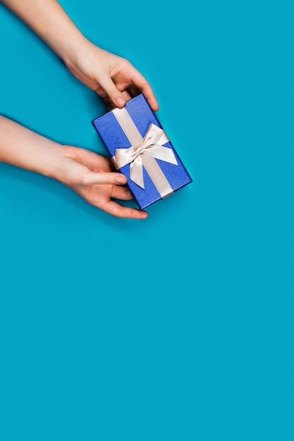 Hands with a gift box