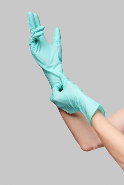 Hands with latex protective gloves