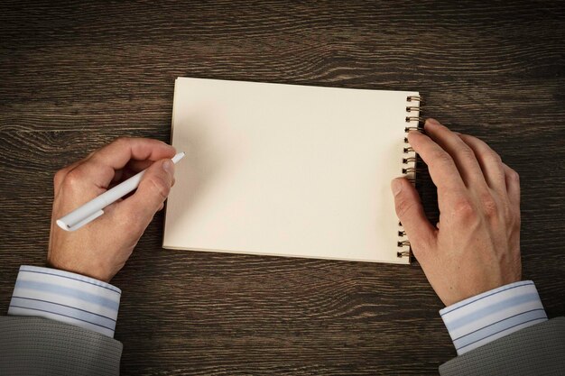 Hands with notes on the desk. Media media