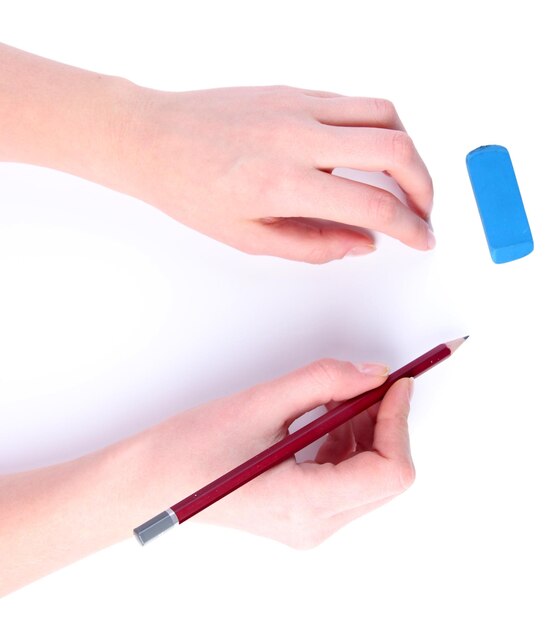 Hands with pencil and eraser isolated on white