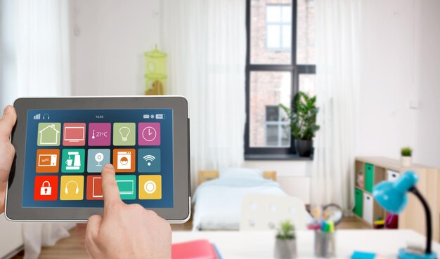 Photo hands with smart home icons on tablet computer