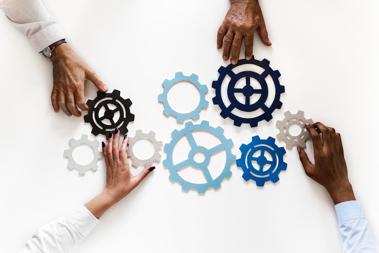 Photo hands with support gears isolated on white background