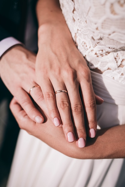 Hands with wedding rings