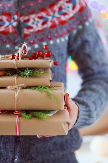 Hands of woman holding christmas gift box Christmas