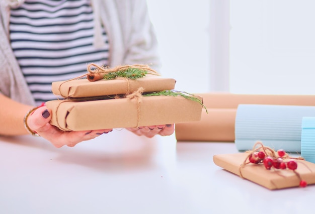 Hands of woman holding christmas gift box