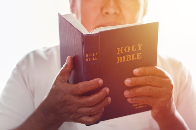 Hands woman with bible praying Christian concept