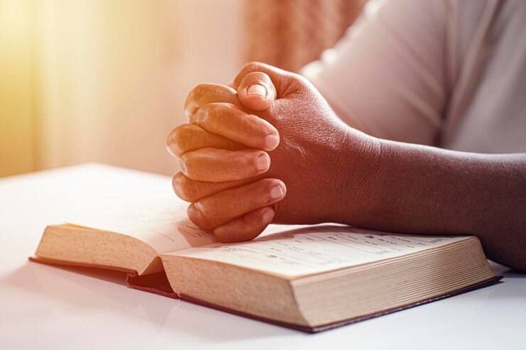 Hands woman with bible praying Christian concept
