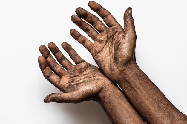 Hands of a worker very dirty for the job
