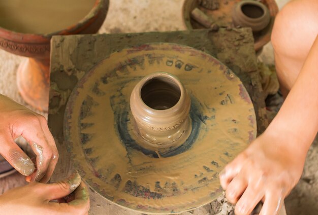 Hands working clay machine working hand 