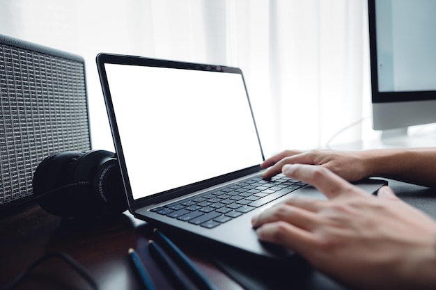 Hands working on a laptop computer