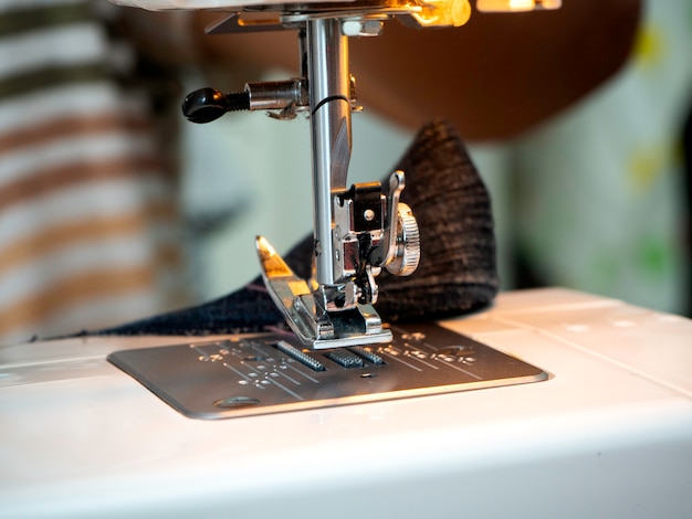 Hands working on the sewing machine