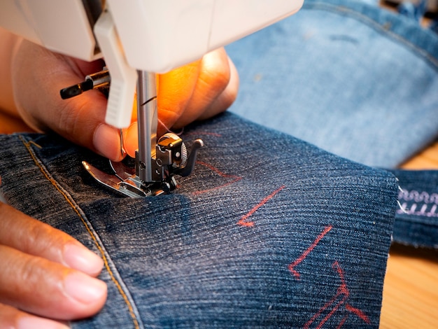 Hands working on the sewing machine