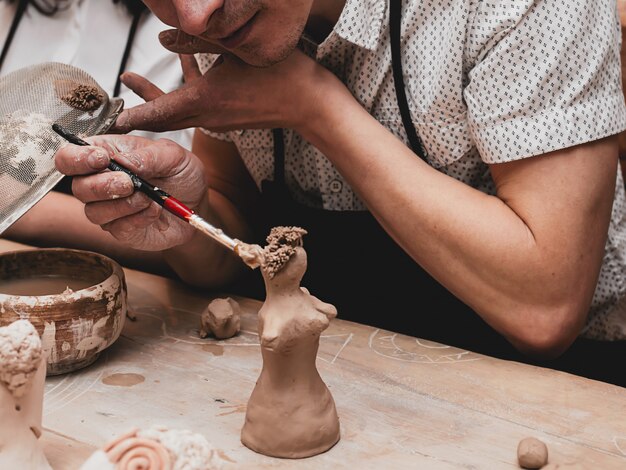 Hands  working with clay