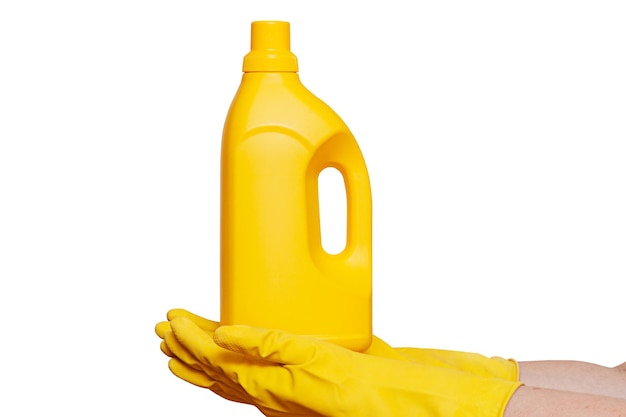 Hands in yellow gloves holding a yellow bottle of cleaning agent household chemicals