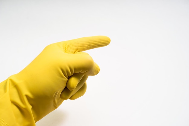Photo hands in yellow rubber gloves on white background