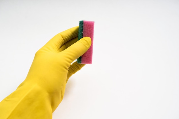 Hands in yellow rubber gloves on white background