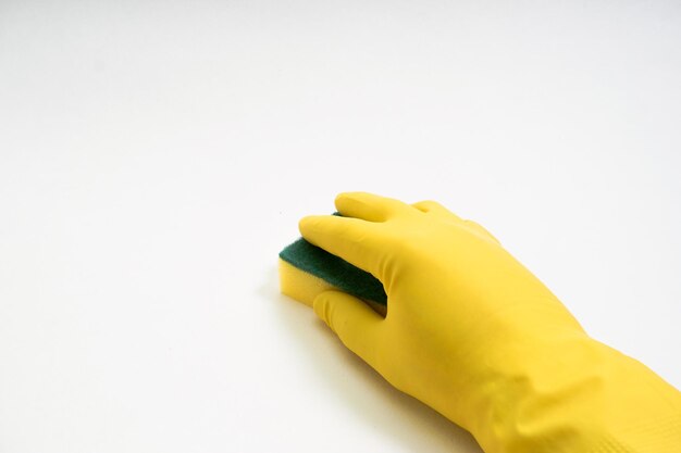 Photo hands in yellow rubber gloves on white background