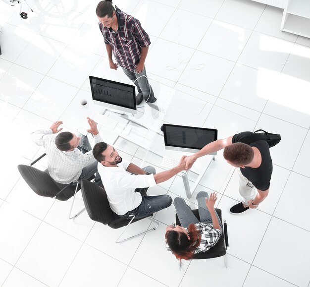 Handshake of Agency staff at the Desk