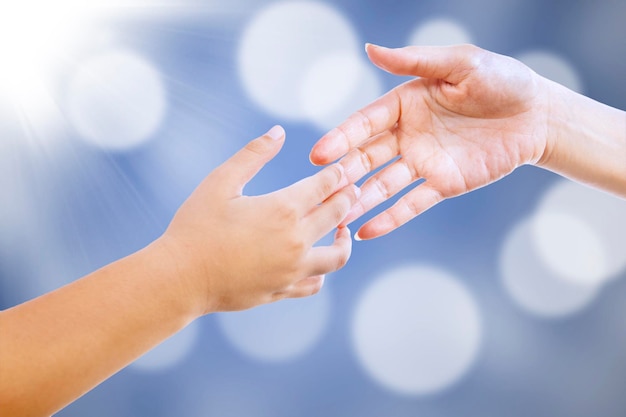 Handshake on blue defocused lights