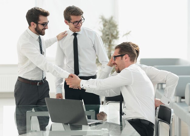 Handshake business colleagues in the workplacephoto with copy space