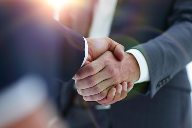 Handshake business concept in office