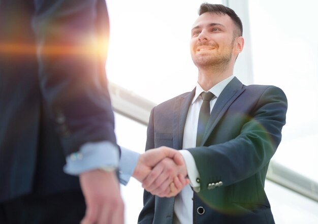 Handshake of business partners after a favorable trade deal