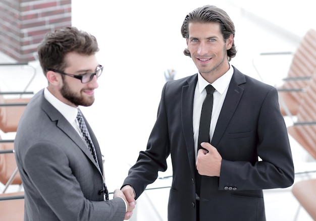 Handshake business partners to the conference room