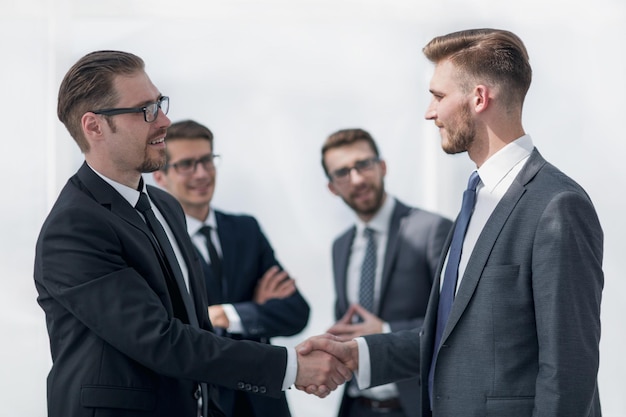 Handshake of business partners on a light background business concept