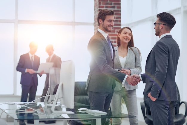 Handshake business partners at a meeting