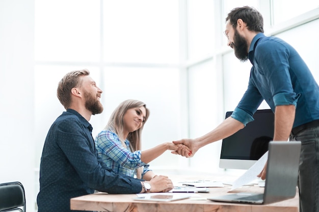 Handshake business people at a meeting in the office. business concept