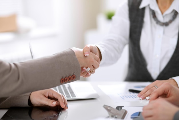 Handshake of business people at negotiations in office