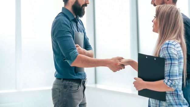 Handshake business people in the office lobby . concept of cooperation