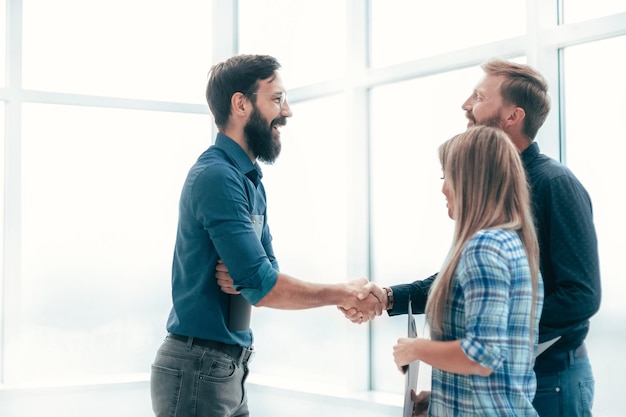 Handshake business people in the office lobby . concept of cooperation