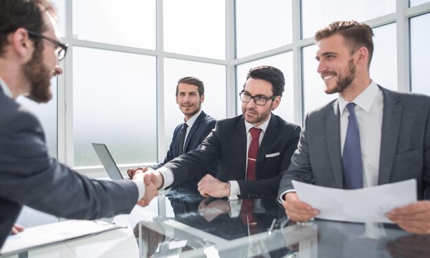 Handshake of business people at a working meeting the concept of cooperation