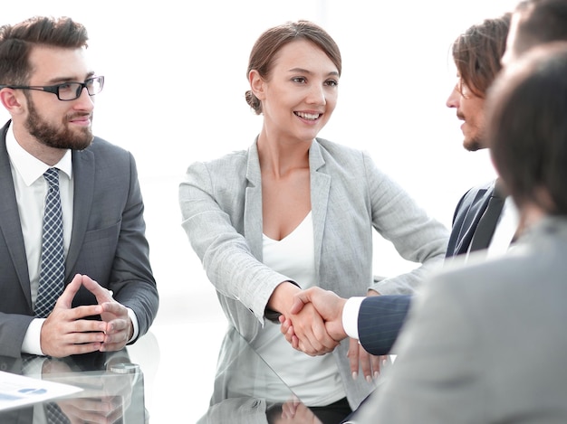 Handshake business women with business partner