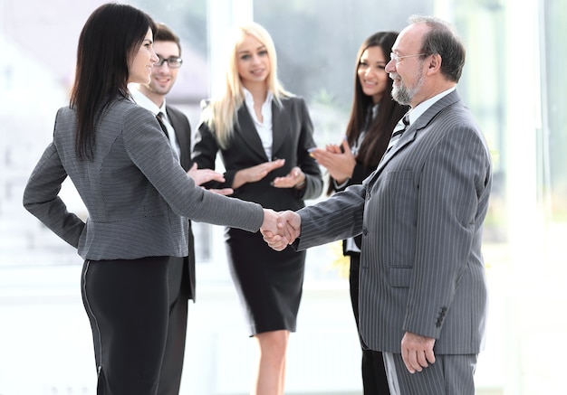 Handshake of a businessman and business woman the concept of cooperation