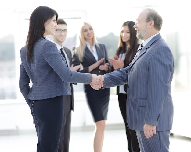 Handshake of a businessman and business woman