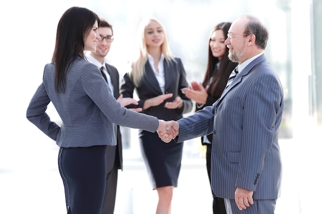 Handshake of a businessman and business woman