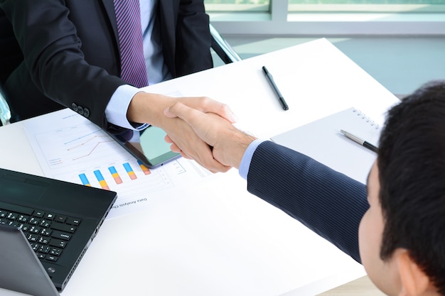 Handshake of businessmen in the office