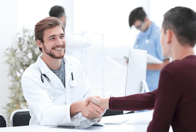 Handshake between doctor and patient