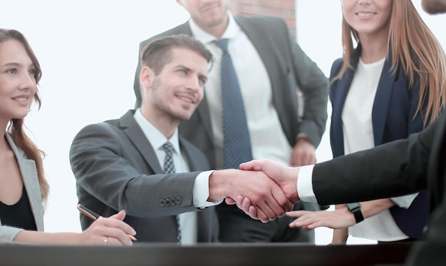 Handshake between employees after the meeting