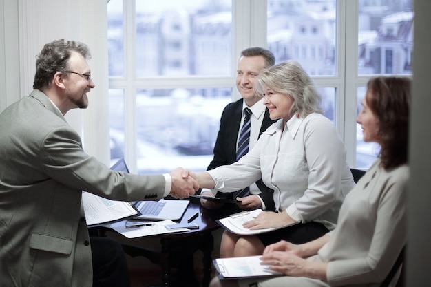 Handshake financial partners prior to discussion of the transaction.