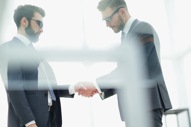 Handshake is serious business partnersthe concept of cooperation