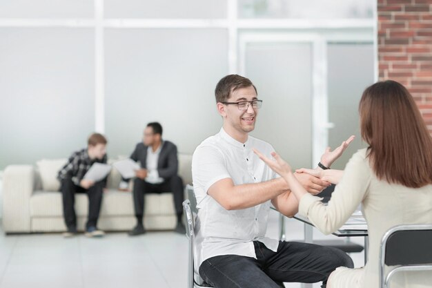 Handshake of the Manager and the client after discussing the contract