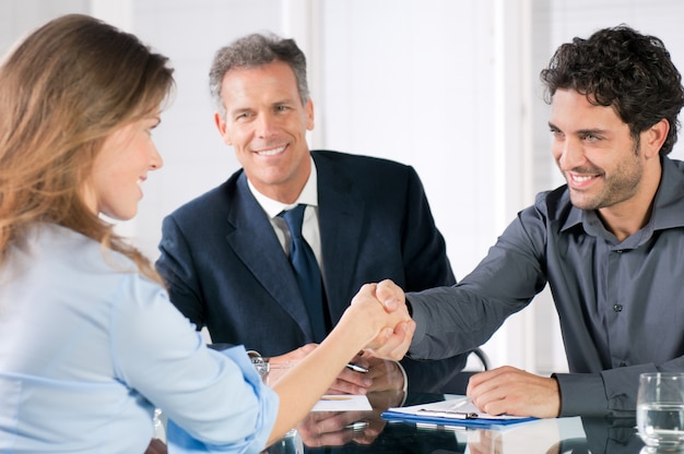 Handshake to seal a deal after a job recruitment meeting