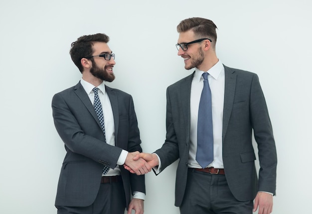 Handshake of two business peopleisolated on light background