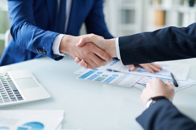 Photo handshaking over desk