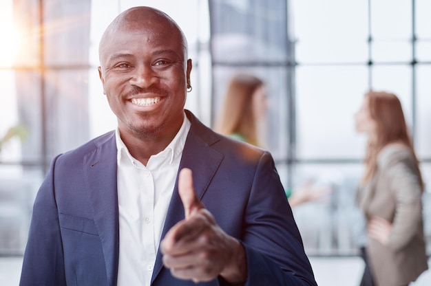 Handsome african american executive businessman in modern office