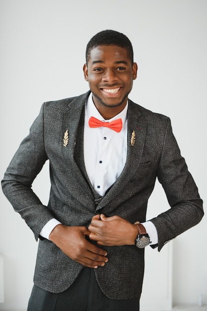 Handsome African-American man near window in office