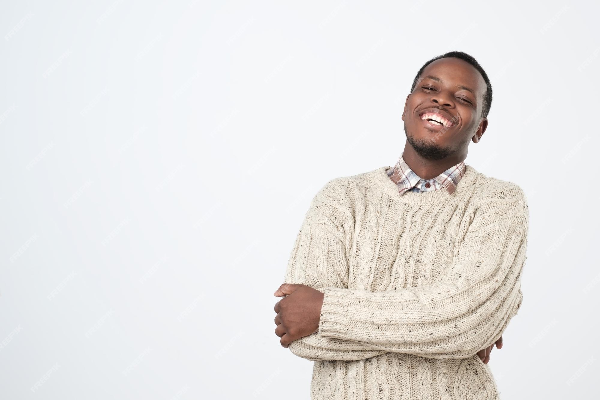 Premium Photo | Handsome african man laughing out loud at funny meme or joke he found on internet smiling broadly Premium Photo | Handsome african man laughing out loud at funny meme or joke he found on internet smiling broadly